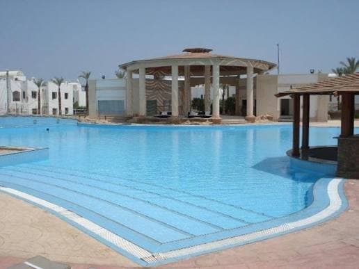 Daytime resort pool and pavilion